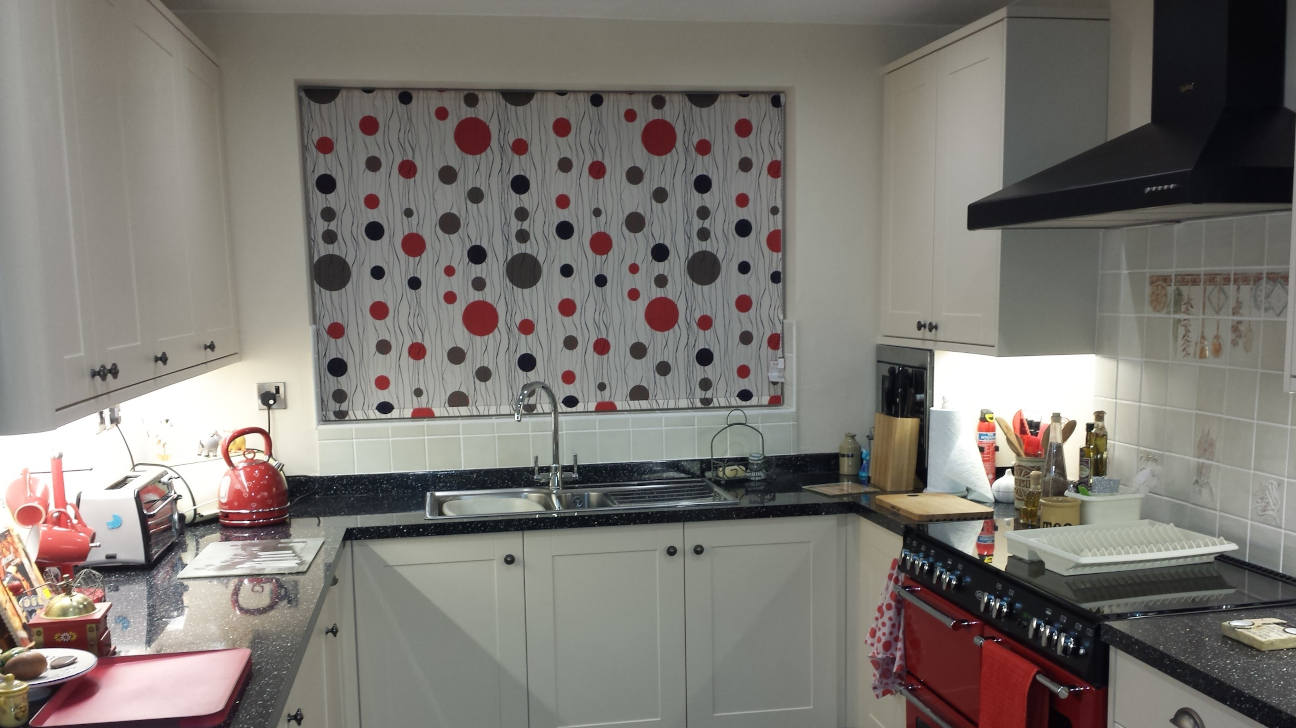 Bedroom featuring blackout roller blinds