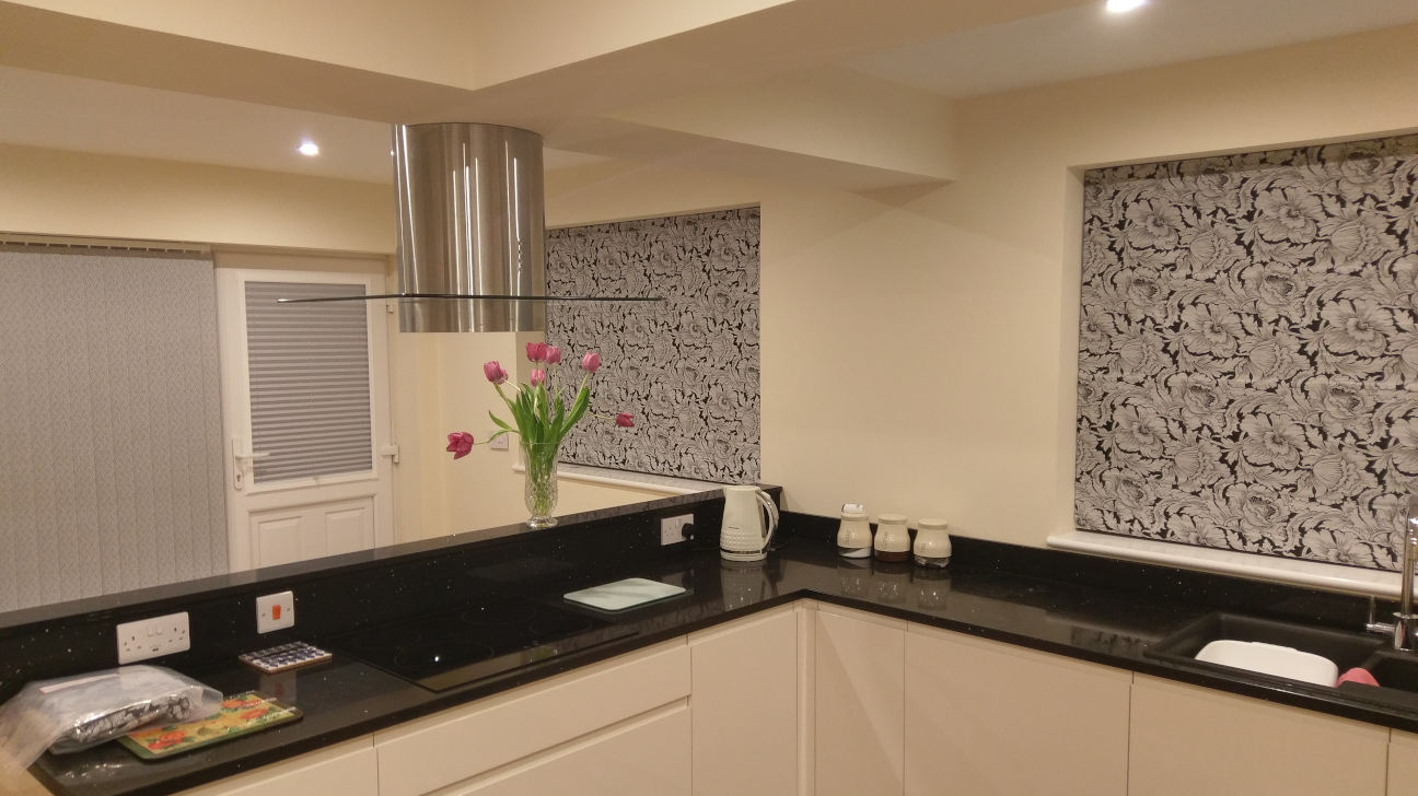 Dining area featuring stylish custom Roman blinds