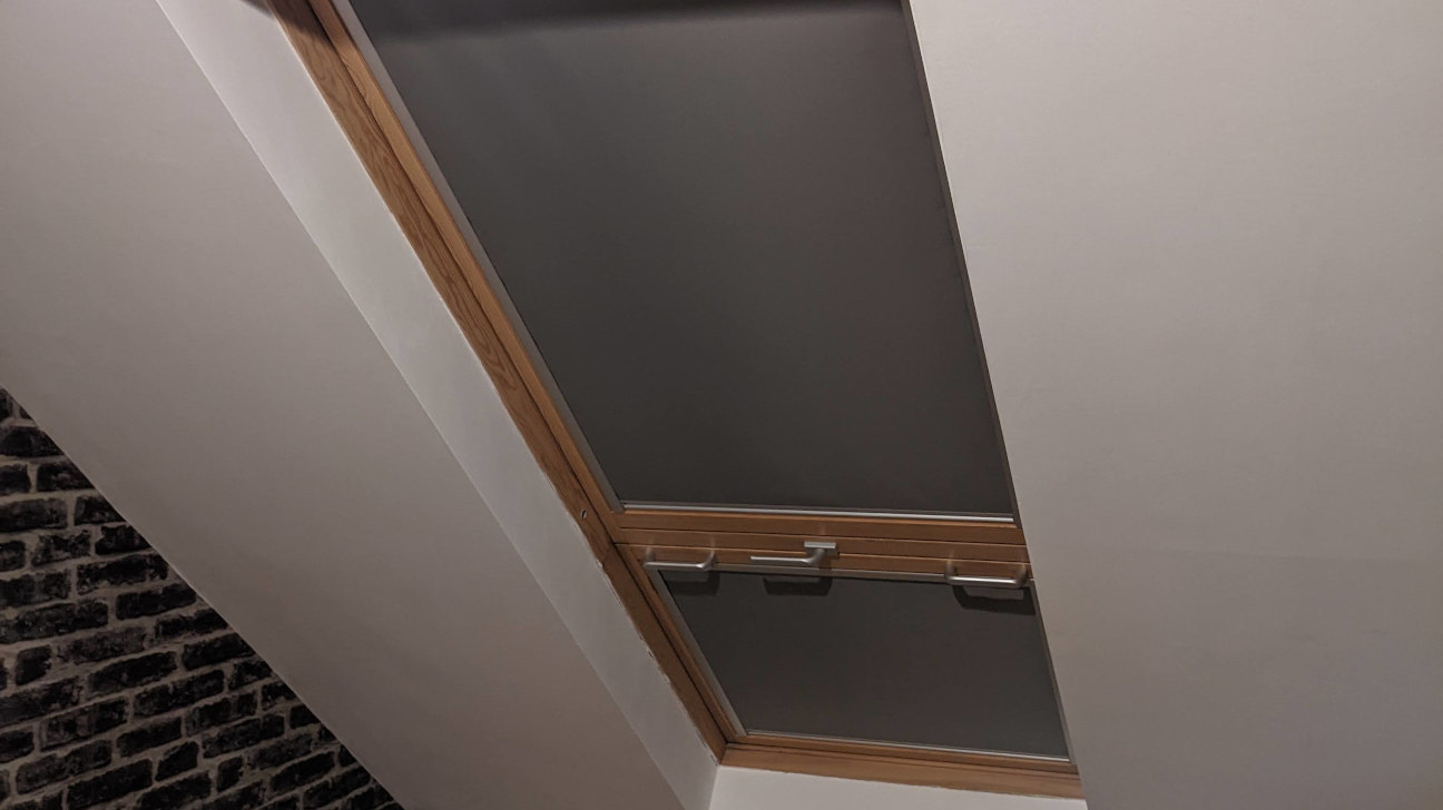 Bedroom with stylish skylight blinds