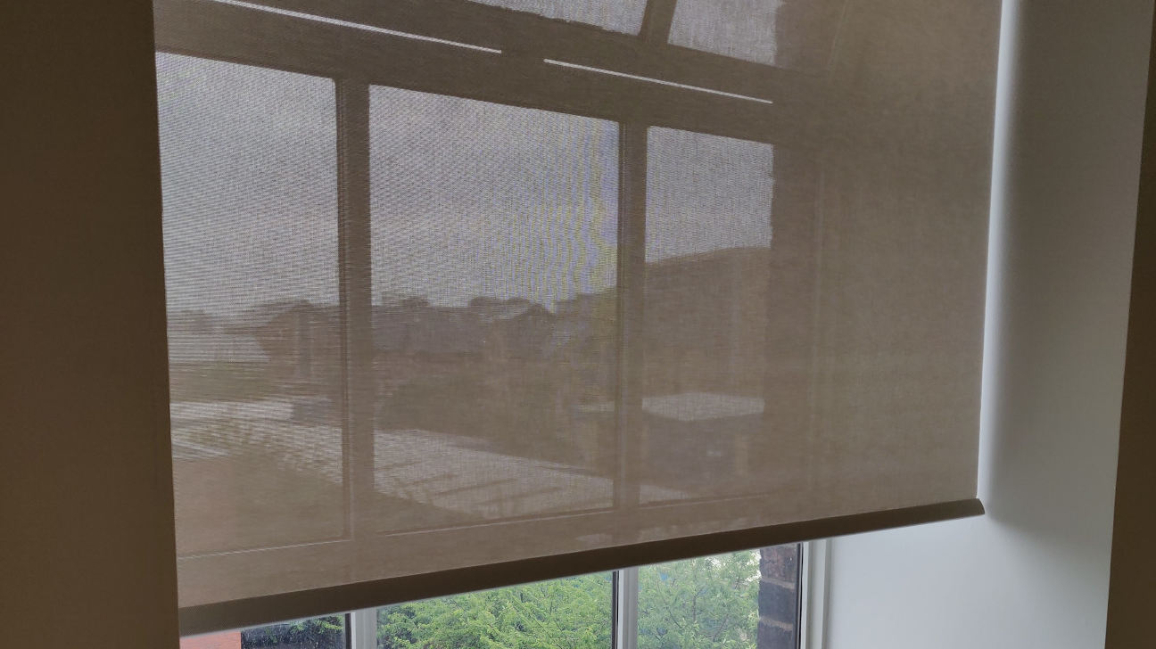 Dining area with patterned roller blinds