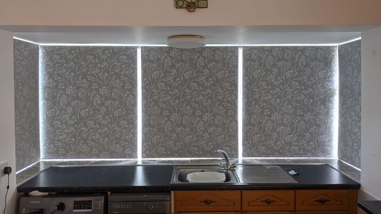Living room showcasing custom roller blinds