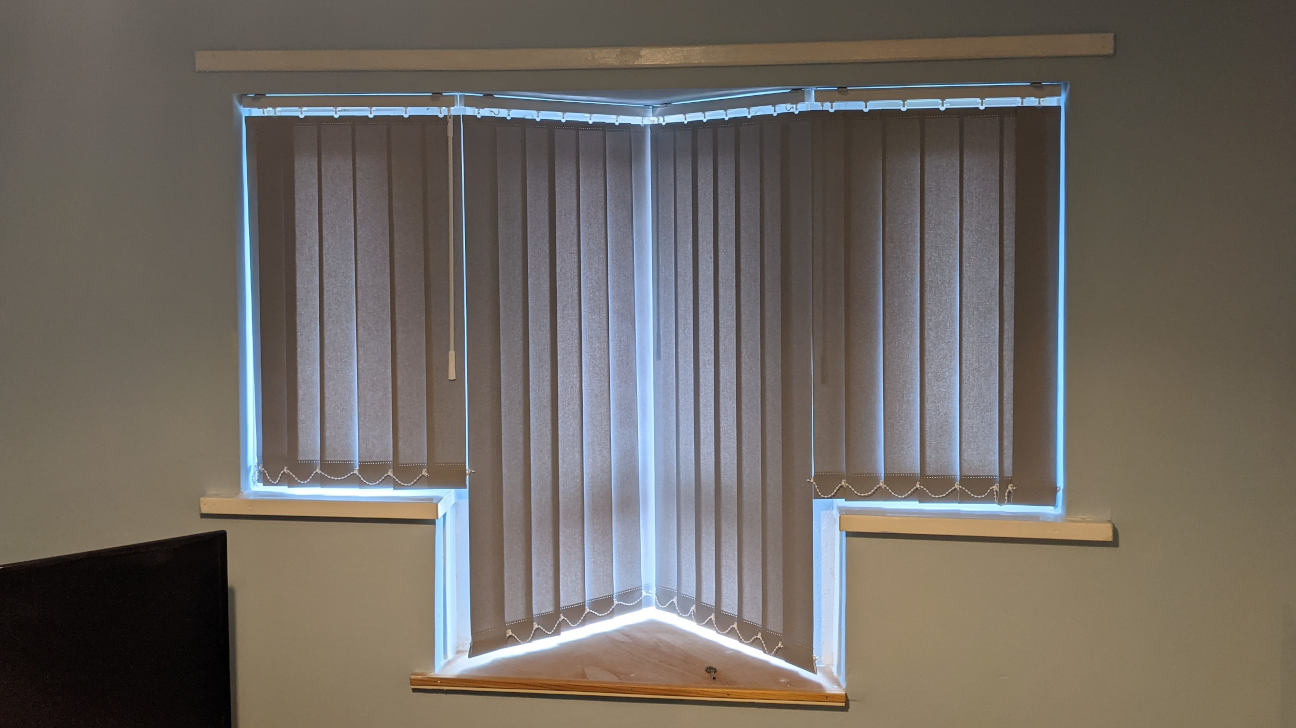 Bedroom featuring stylish vertical blinds